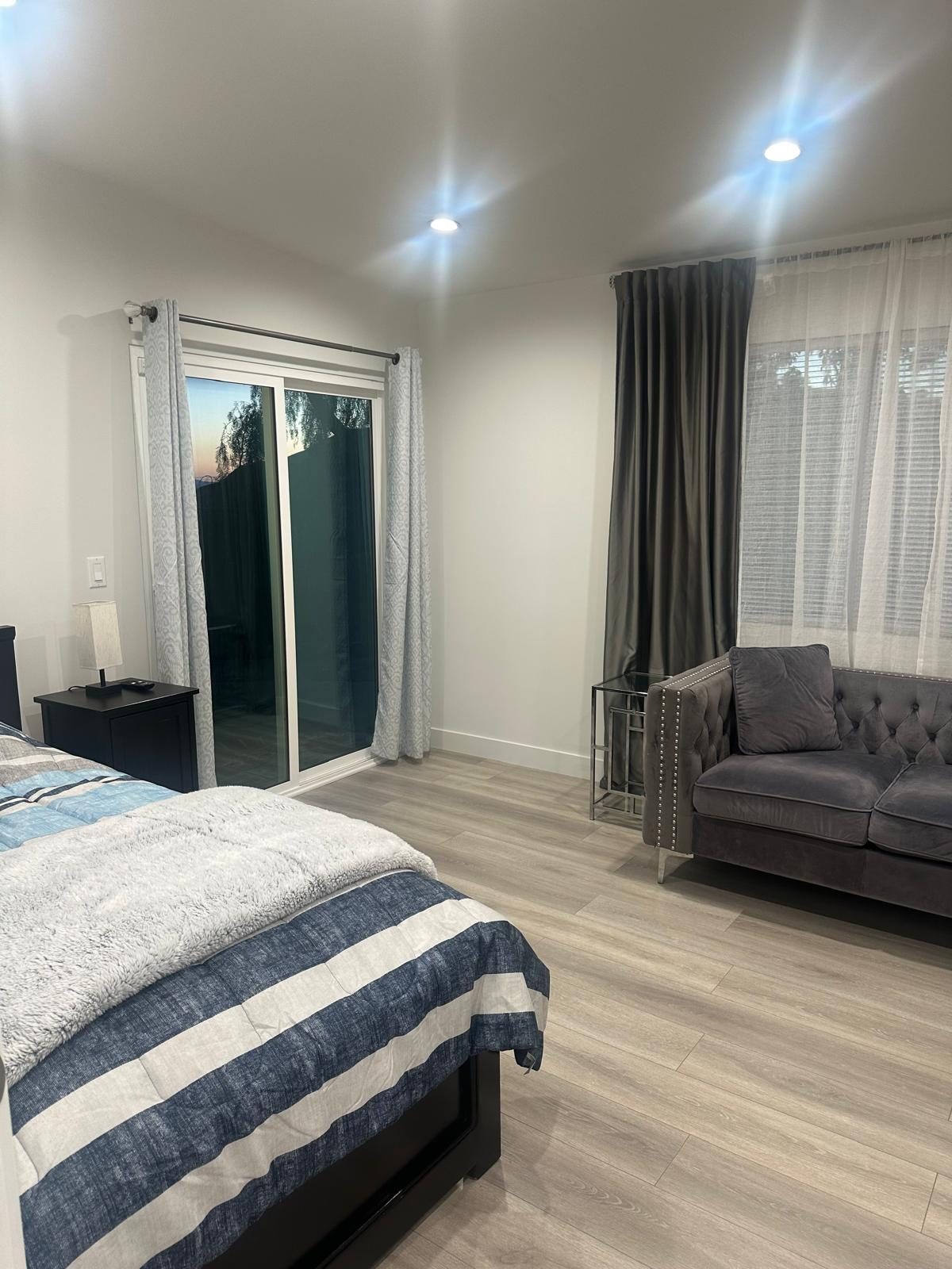 Private resident bedroom with sitting area at Allure Senior Living in Sunland